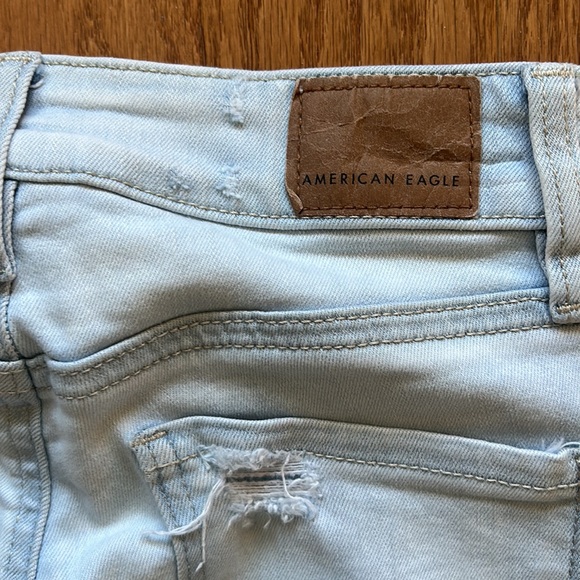AMERICAN EAGLE NEXT LEVEL STRETCH DISTRESSED ROW HEM MID RISE LIGHT BLUE SIZE 00 - Picture 4 of 6